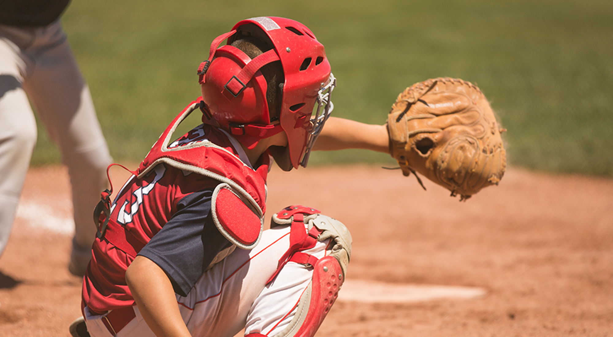 Youth Baseball Catcher During Game
