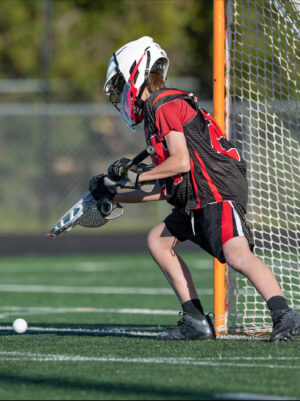 Young Athletes Making Amazing Plays While Playing In A Lacrosse